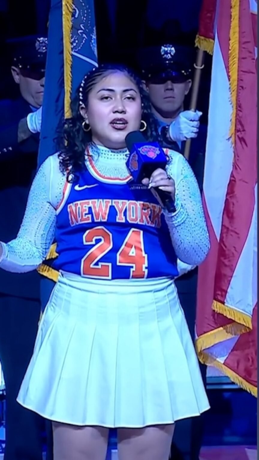 Video Woman pauses National Anthem after interruption — then slays rest of the performance