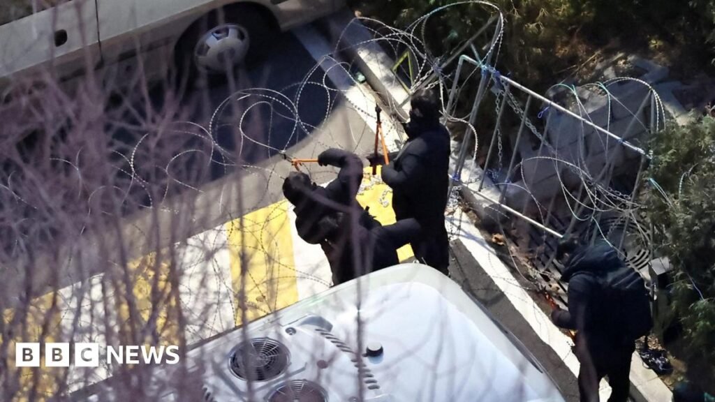 Investigators scale barbed wire to arrest S Korea’s impeached president